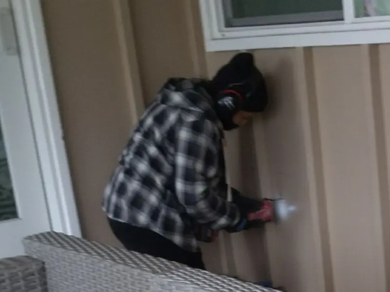 Professional electrician installing an exterior outlet in Lucerne